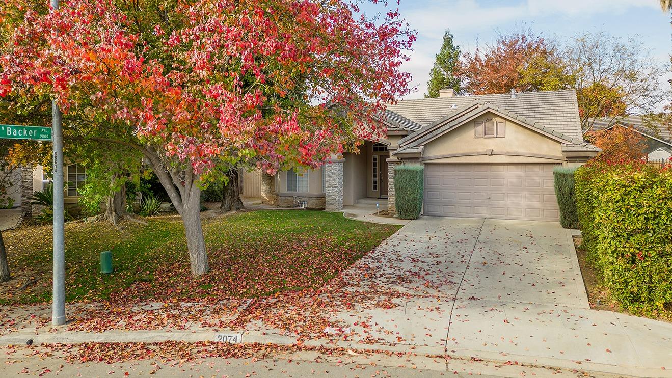 2074 East Revere Road Fresno, CA 93720 - Photo 31 of 39 a house view with a backyard space