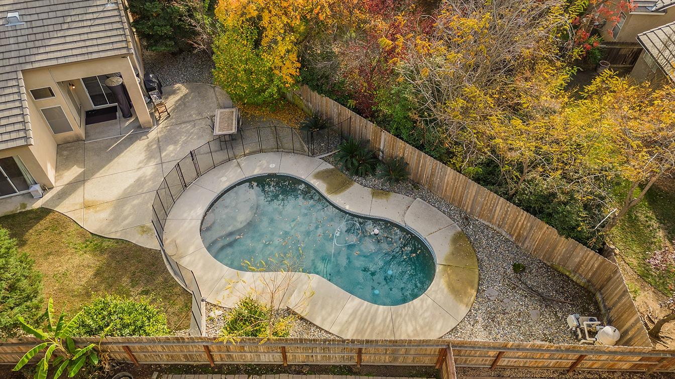 2074 East Revere Road Fresno, CA 93720 - Photo 33 of 39 a swimming pool with outdoor seating and yard