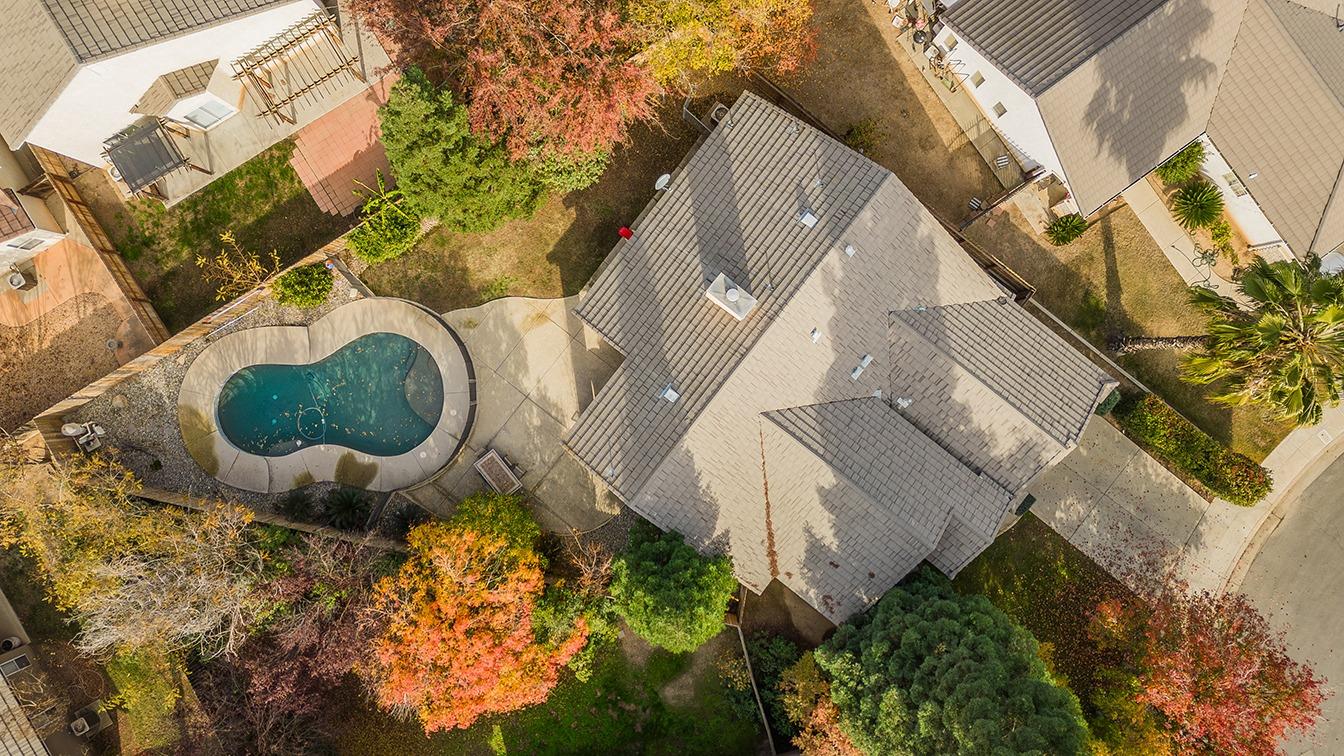 2074 East Revere Road Fresno, CA 93720 - Photo 37 of 39 a backyard of a house with lots of green space