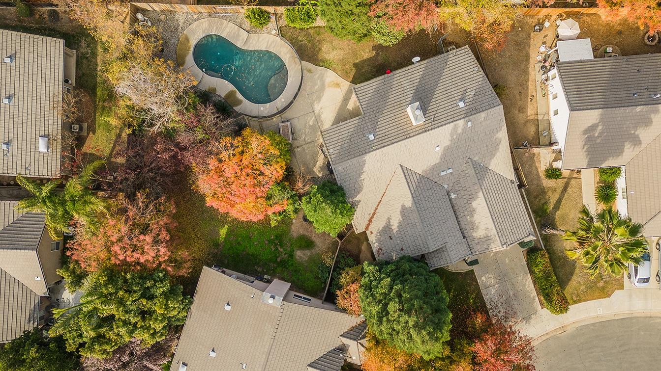 2074 East Revere Road Fresno, CA 93720 - Photo 38 of 39 an aerial view of a house with outdoor space and swimming pool