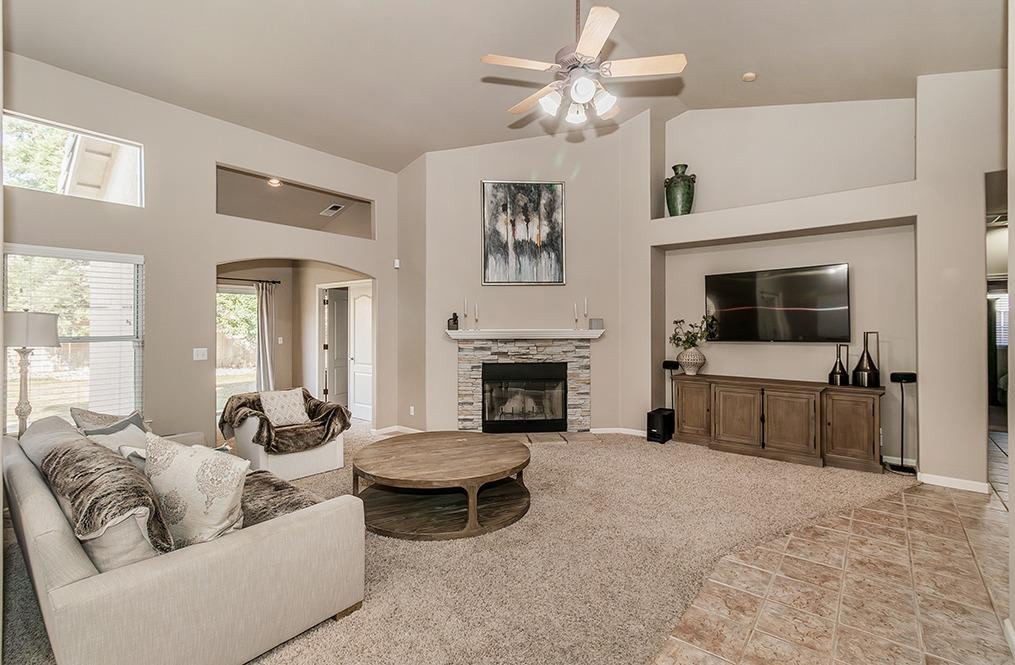 2074 East Revere Road Fresno, CA 93720 - Photo 4 of 39 a living room with furniture and a fireplace