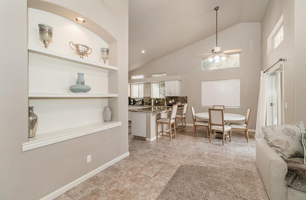 2074 East Revere Road Fresno, CA 93720 - Photo 6 of 39 a view of a kitchen with furniture and a table