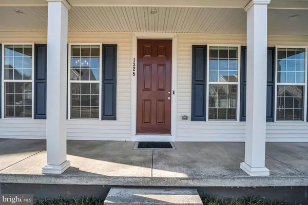 a front view of a house with garage