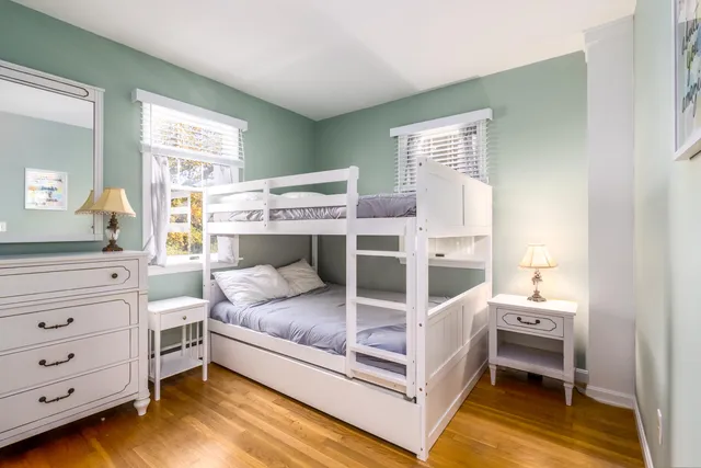 a bedroom with a bed and a mirror