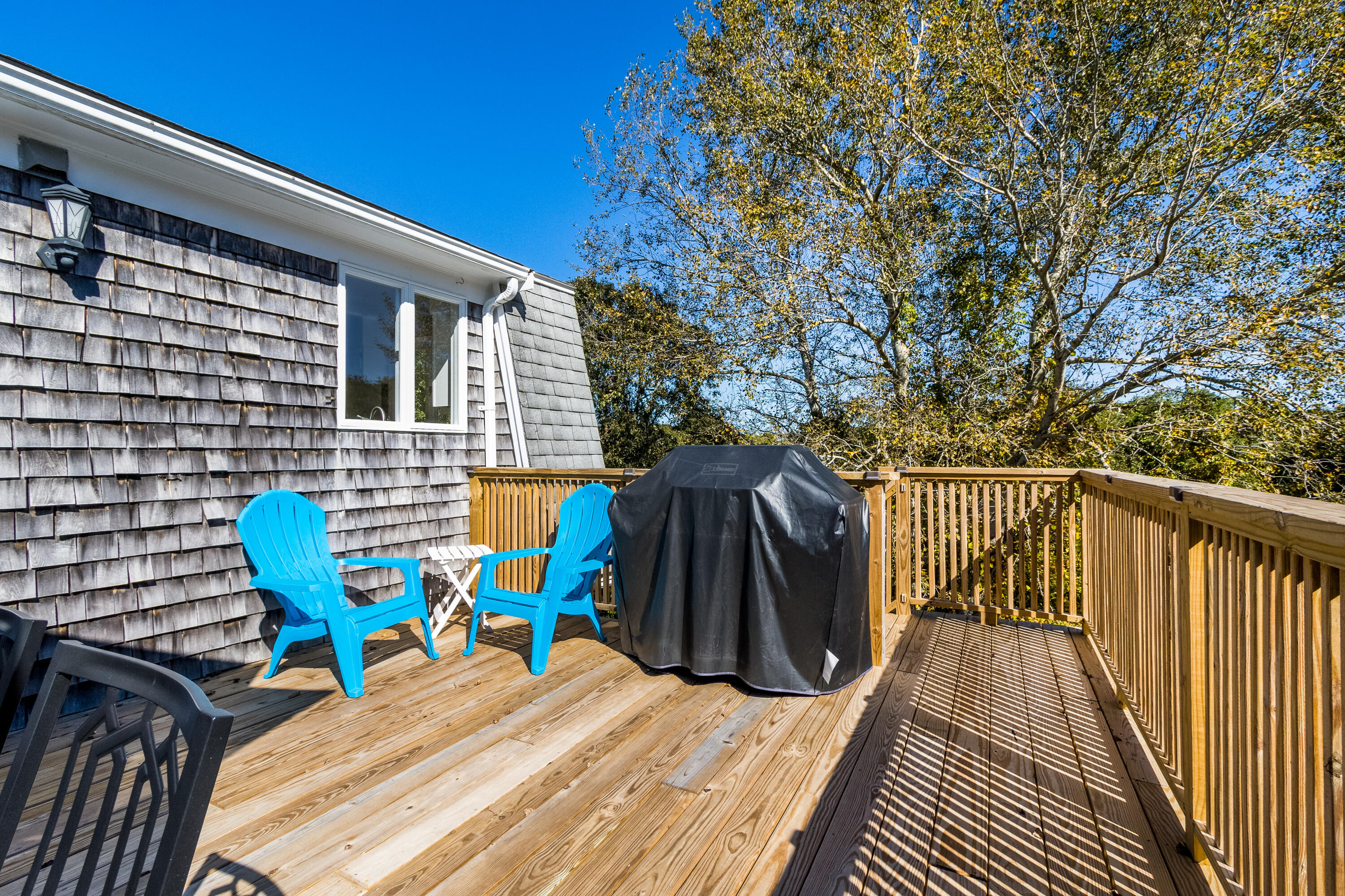 9 Honeysuckle Lane Orleans, MA 02653 - Photo 19 of 26 a view of deck with chairs and wooden floor