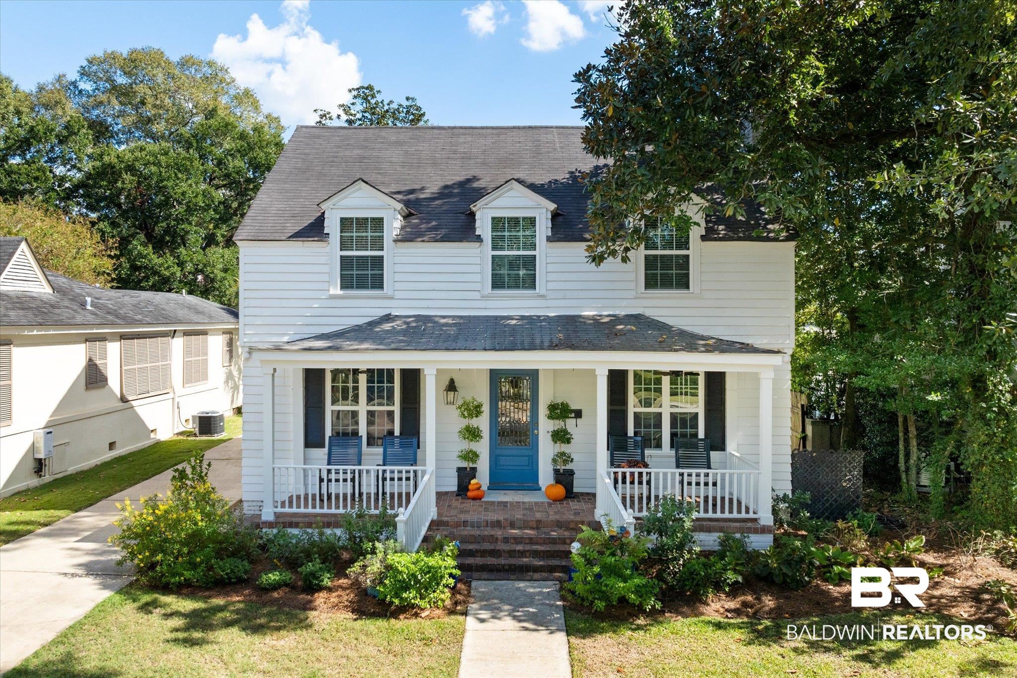 202 Woodlands Avenue Mobile, AL 36607 - Photo 1 of 53 View of front of house with covered porch and central AC