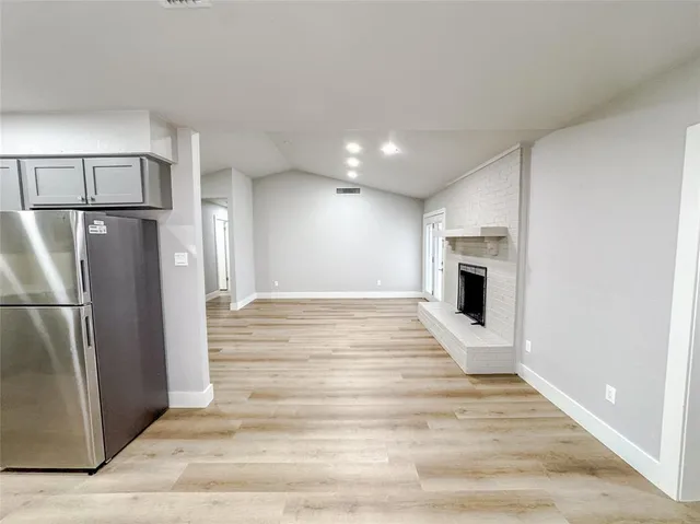 a view of kitchen appliances refrigerator microwave and stove