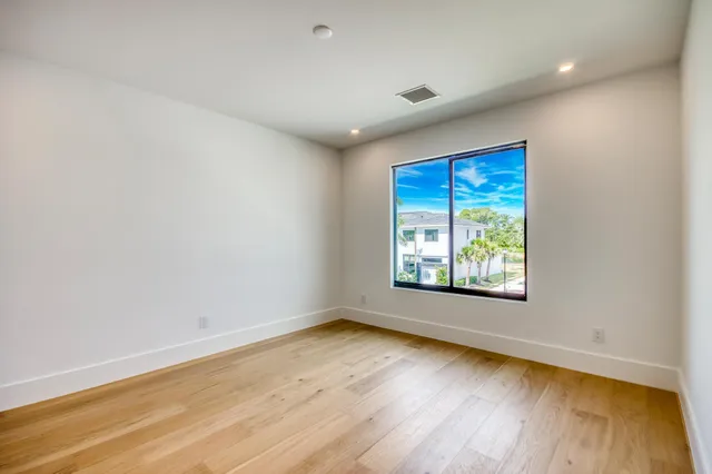 a aerial view of a house with a yard and potted plants
