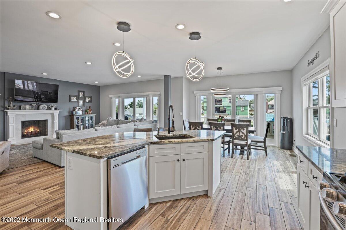 35 Channel Road Toms River, NJ 08753 - Photo 2 of 41 an open kitchen with a sink and breakfast area