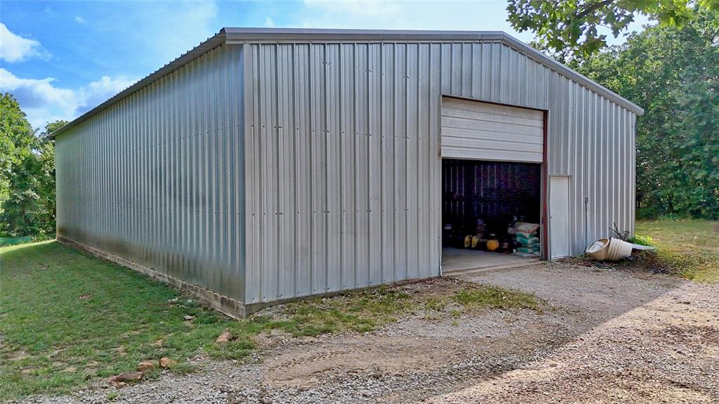 4509 Lazy E Road St. Jo, TX 76265 - Photo 19 of 39 a view of a house with backyard