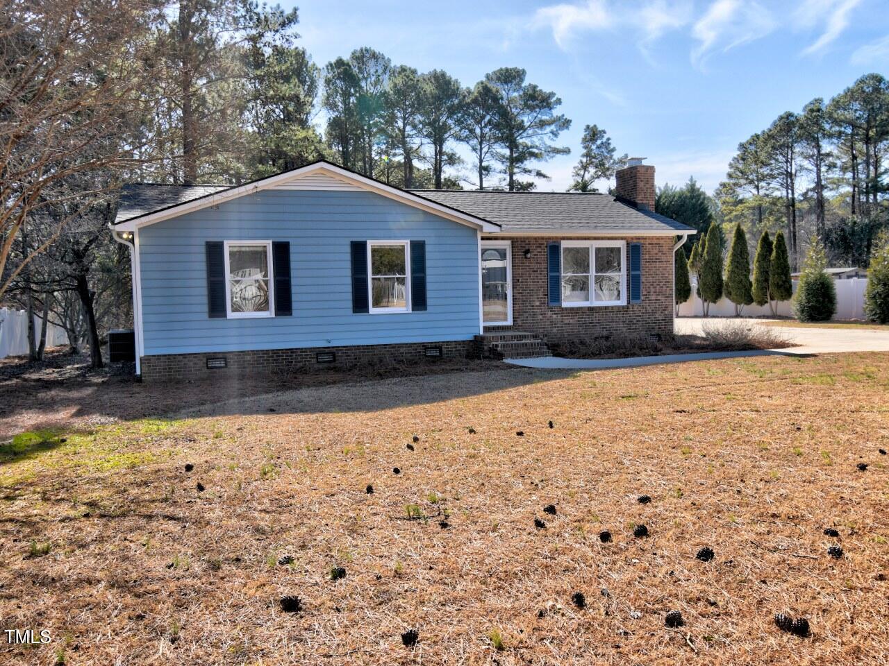 3217 Banks Road Raleigh, NC 27603 - Photo 1 of 29 a front view of a house with a yard