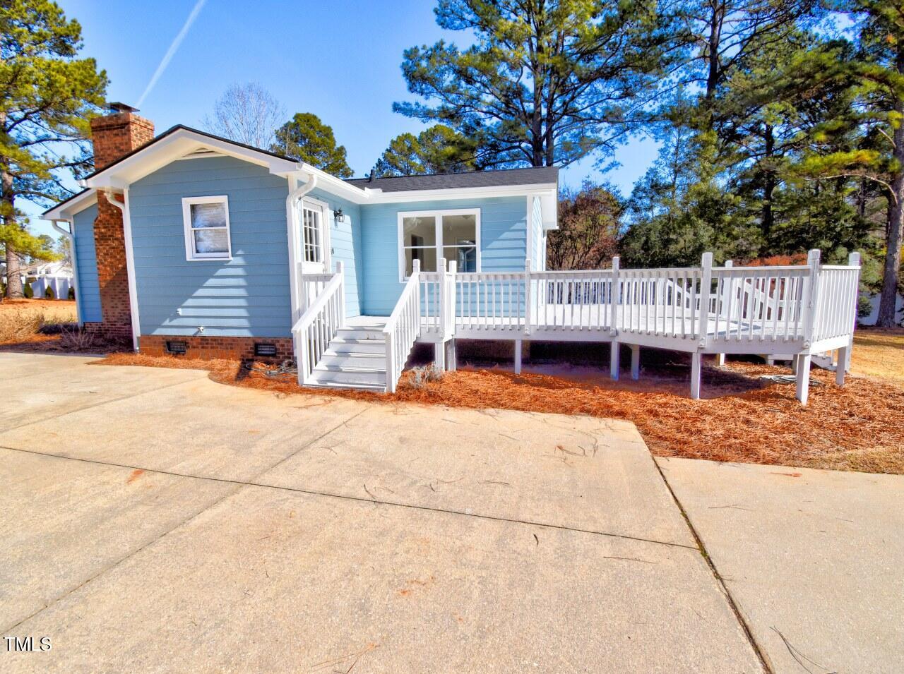 3217 Banks Road Raleigh, NC 27603 - Photo 21 of 29 a view of a house with a patio and a yard