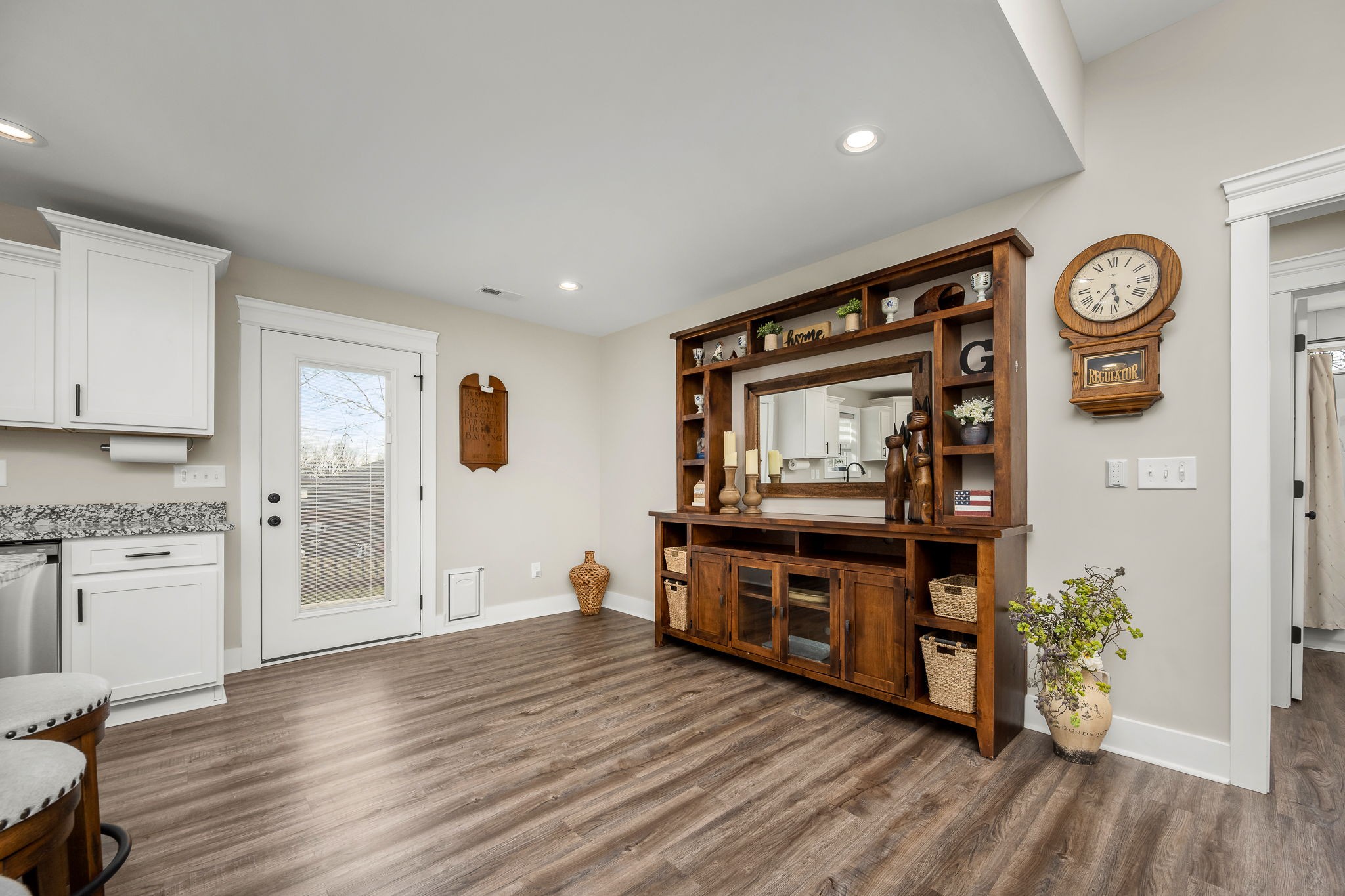 104 Rolling Road Shelbyville, TN 37160 - Photo 12 of 44 a living room with stainless steel appliances kitchen island granite countertop a refrigerator a stove and a wooden floors
