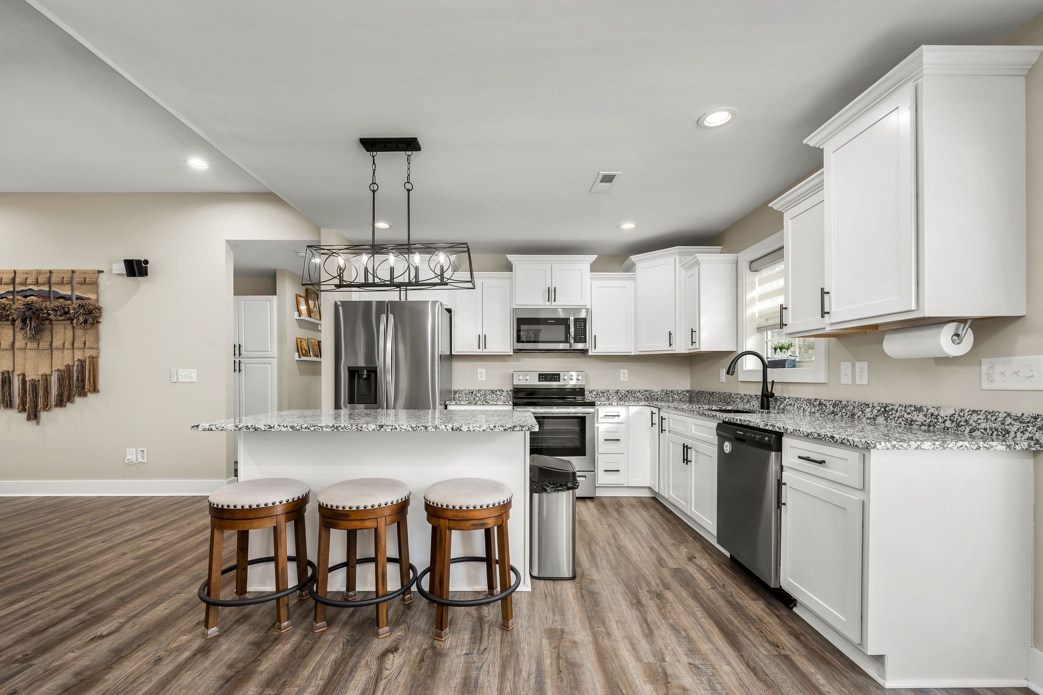 104 Rolling Road Shelbyville, TN 37160 - Photo 15 of 44 a kitchen with stainless steel appliances granite countertop a dining table chairs stove refrigerator and cabinets