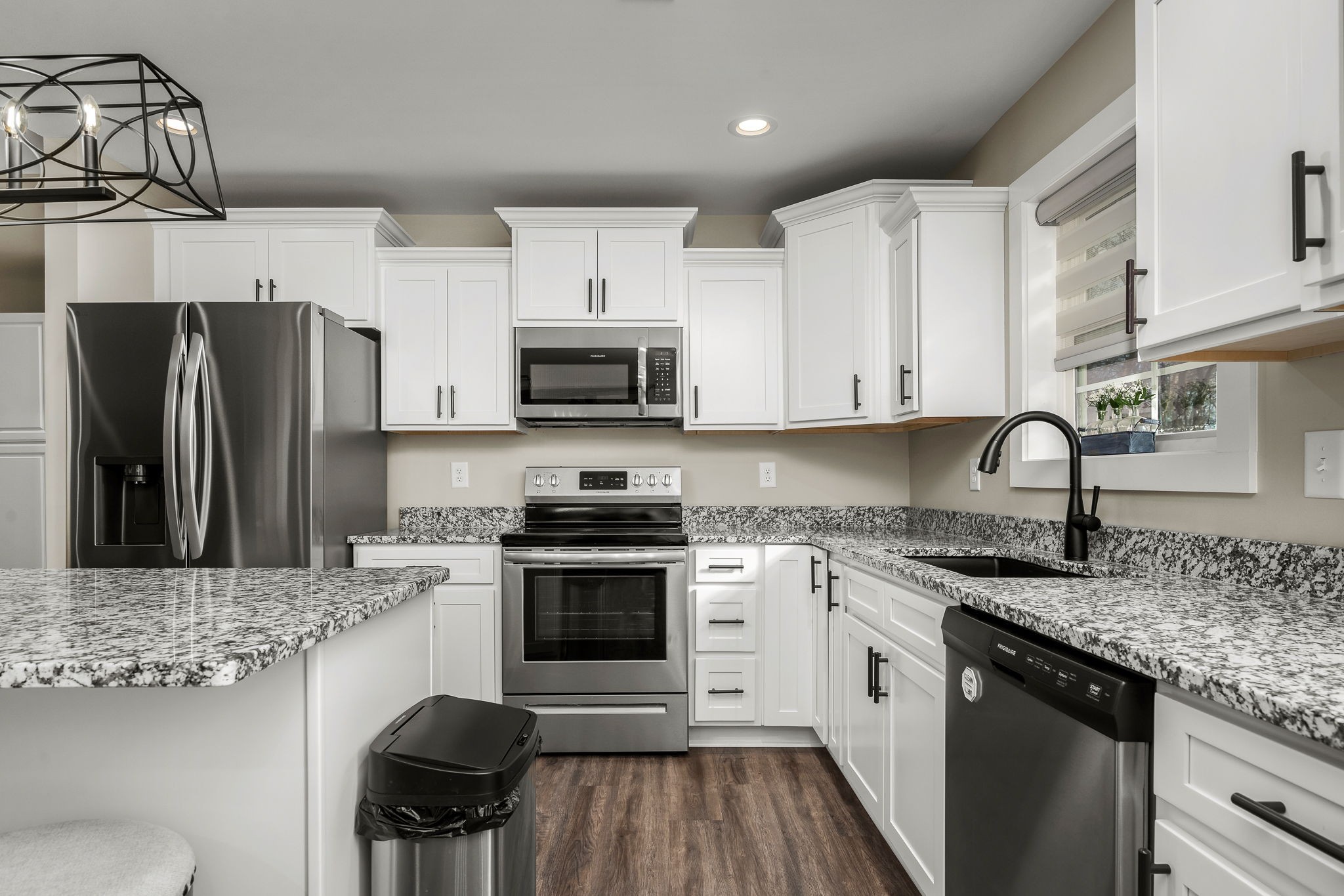 104 Rolling Road Shelbyville, TN 37160 - Photo 17 of 44 a kitchen with stainless steel appliances granite countertop a stove refrigerator sink and cabinets