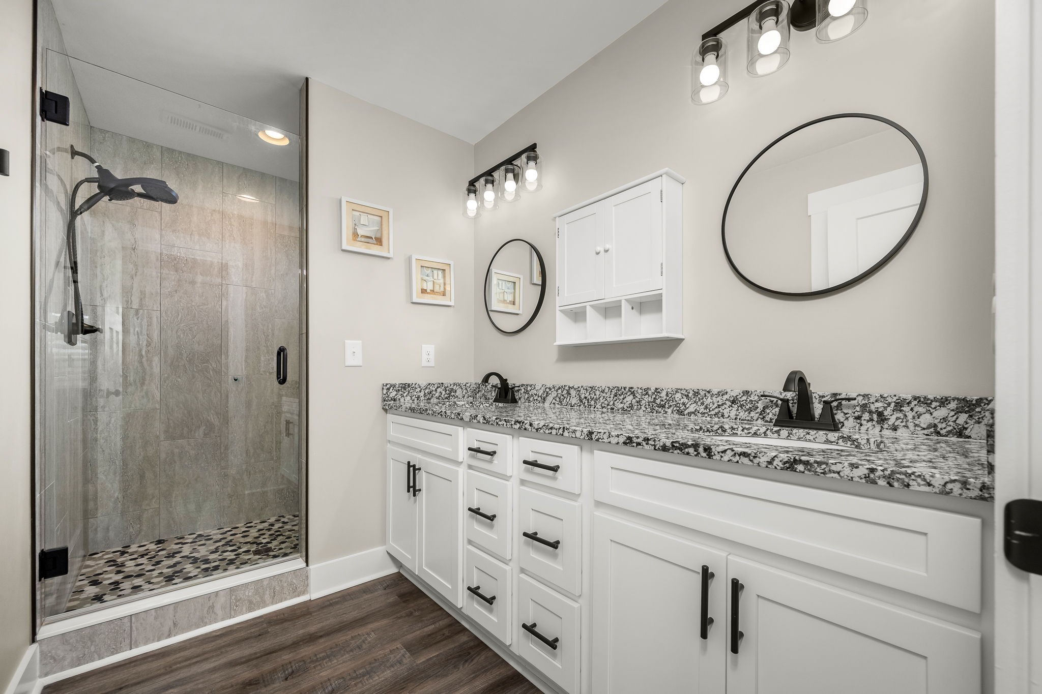 104 Rolling Road Shelbyville, TN 37160 - Photo 21 of 44 a bathroom with a granite countertop sink mirror toilet and shower