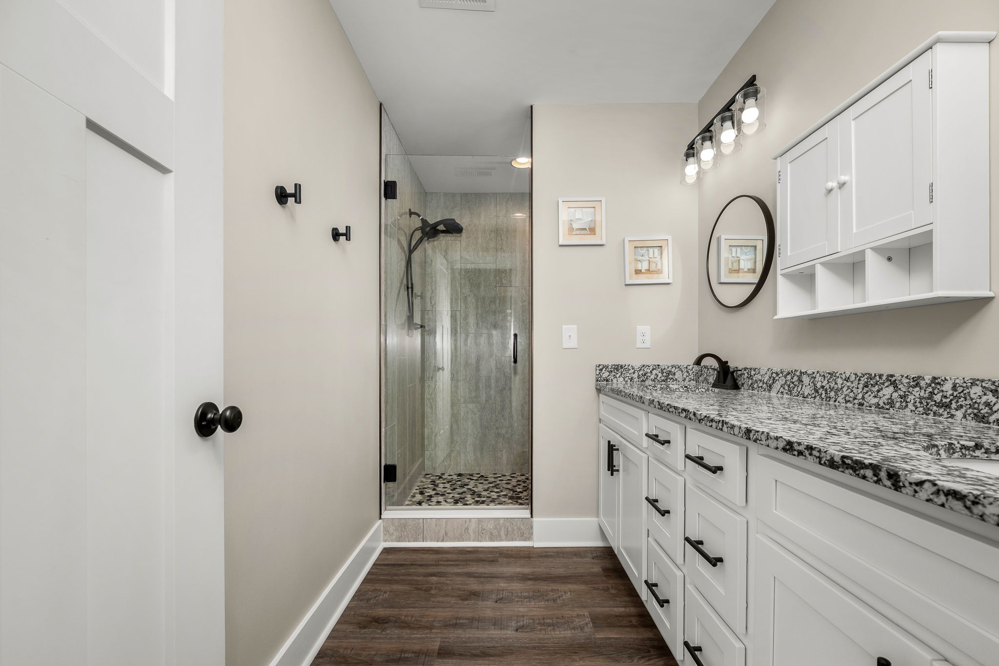 104 Rolling Road Shelbyville, TN 37160 - Photo 22 of 44 a spacious bathroom with a granite countertop sink and a mirror