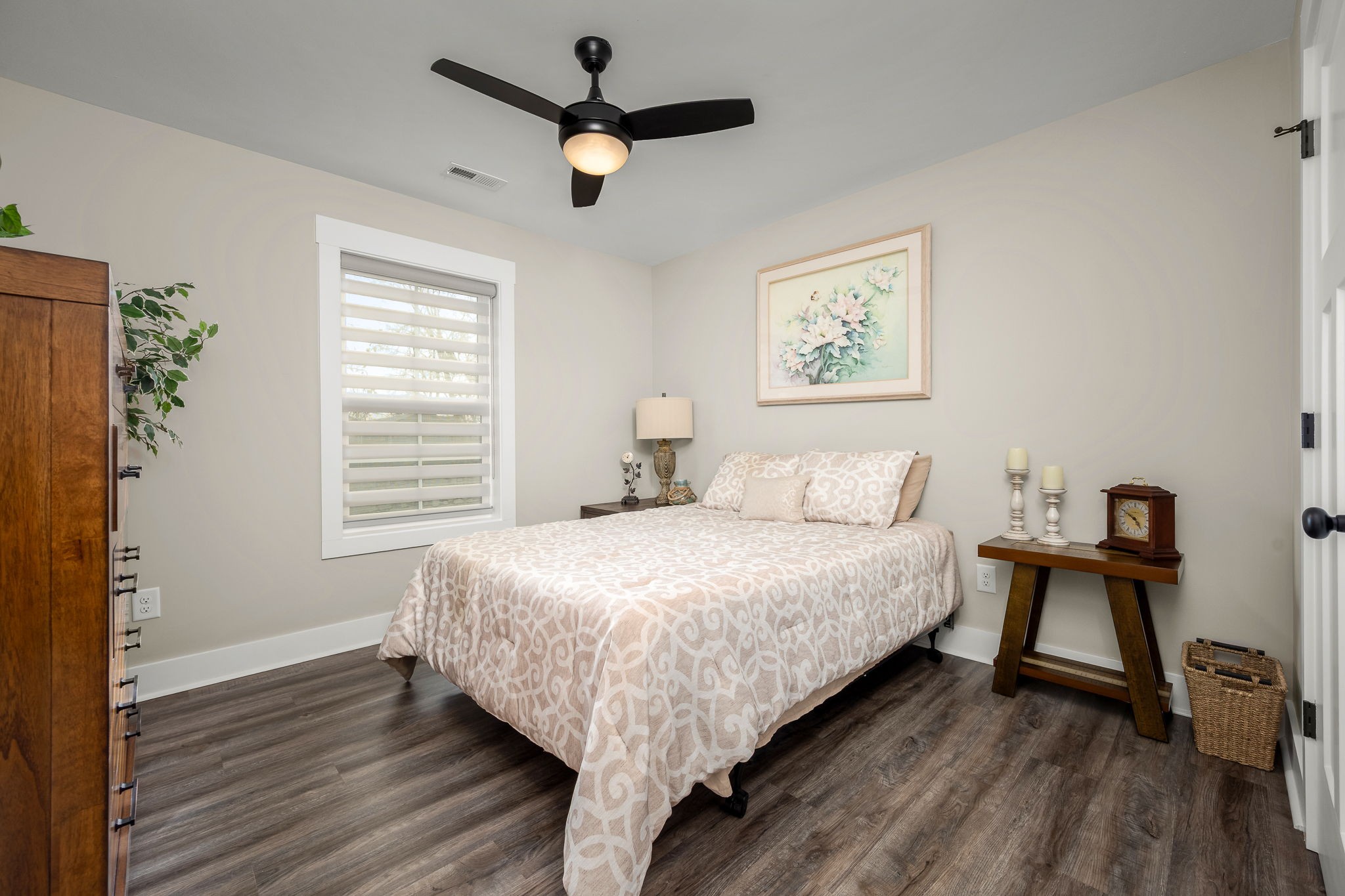 104 Rolling Road Shelbyville, TN 37160 - Photo 26 of 44 a large bed sitting in a bedroom next to a window and a chair