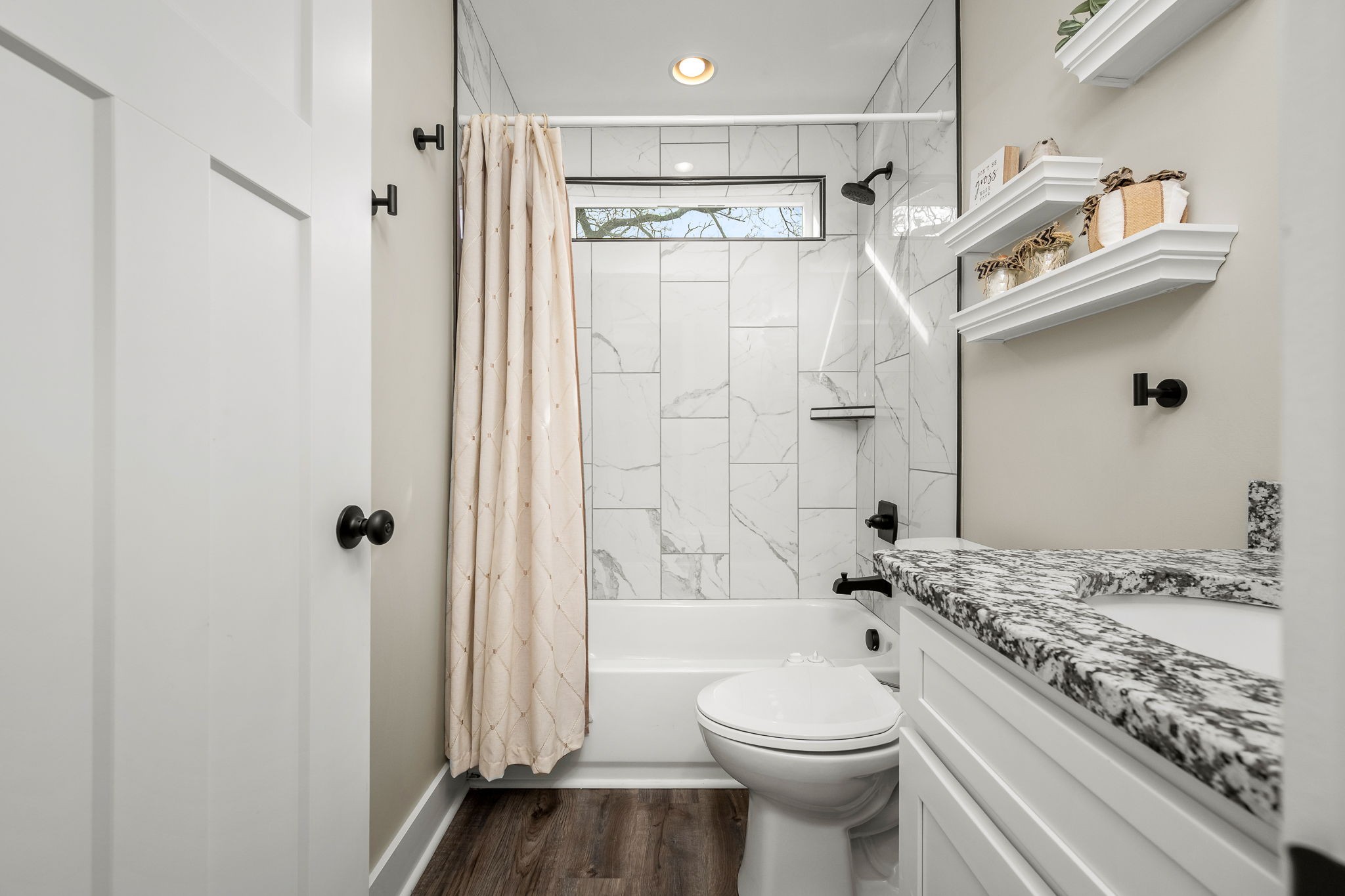 104 Rolling Road Shelbyville, TN 37160 - Photo 28 of 44 a bathroom with a granite countertop sink toilet and shower