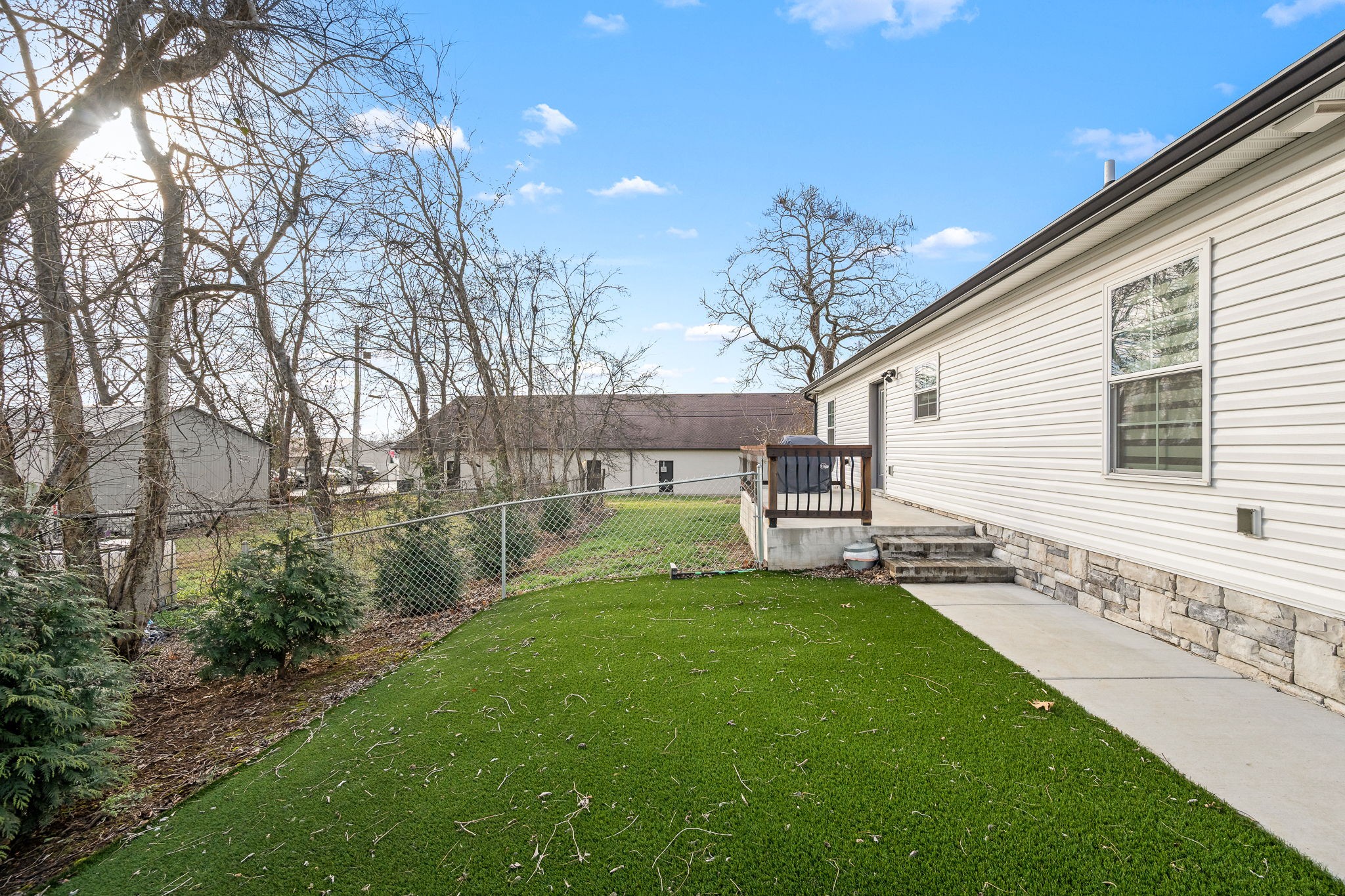 104 Rolling Road Shelbyville, TN 37160 - Photo 36 of 44 a view of a backyard with a large tree