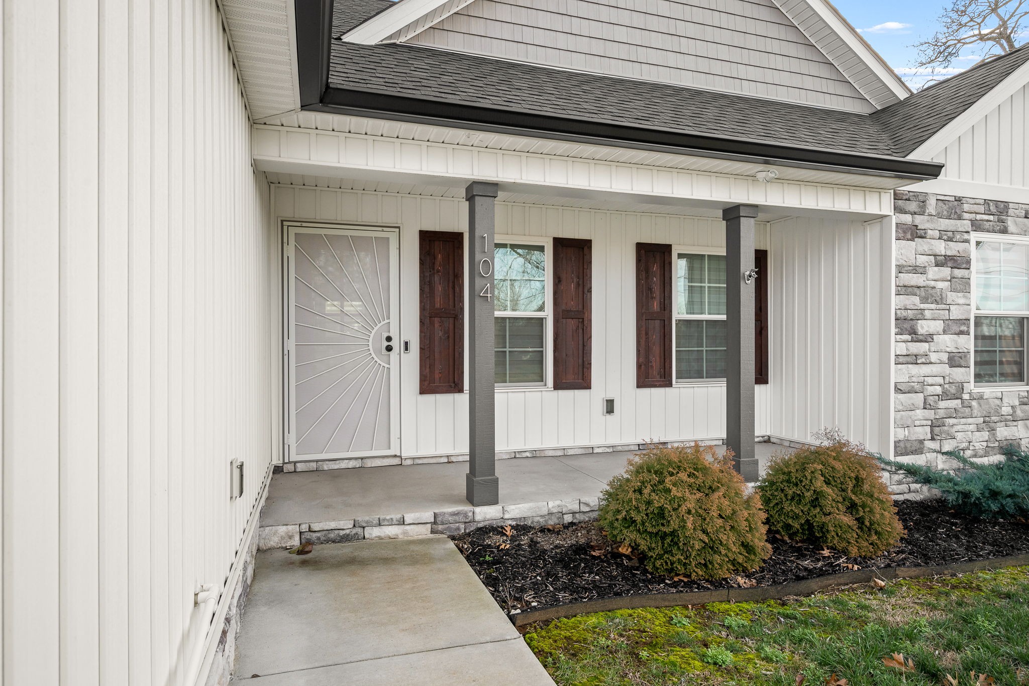 104 Rolling Road Shelbyville, TN 37160 - Photo 4 of 44 a front view of a house with a yard