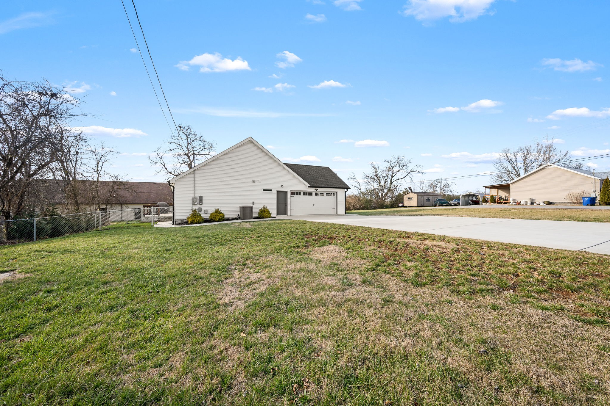 104 Rolling Road Shelbyville, TN 37160 - Photo 41 of 44 a view of a house with a yard and garage