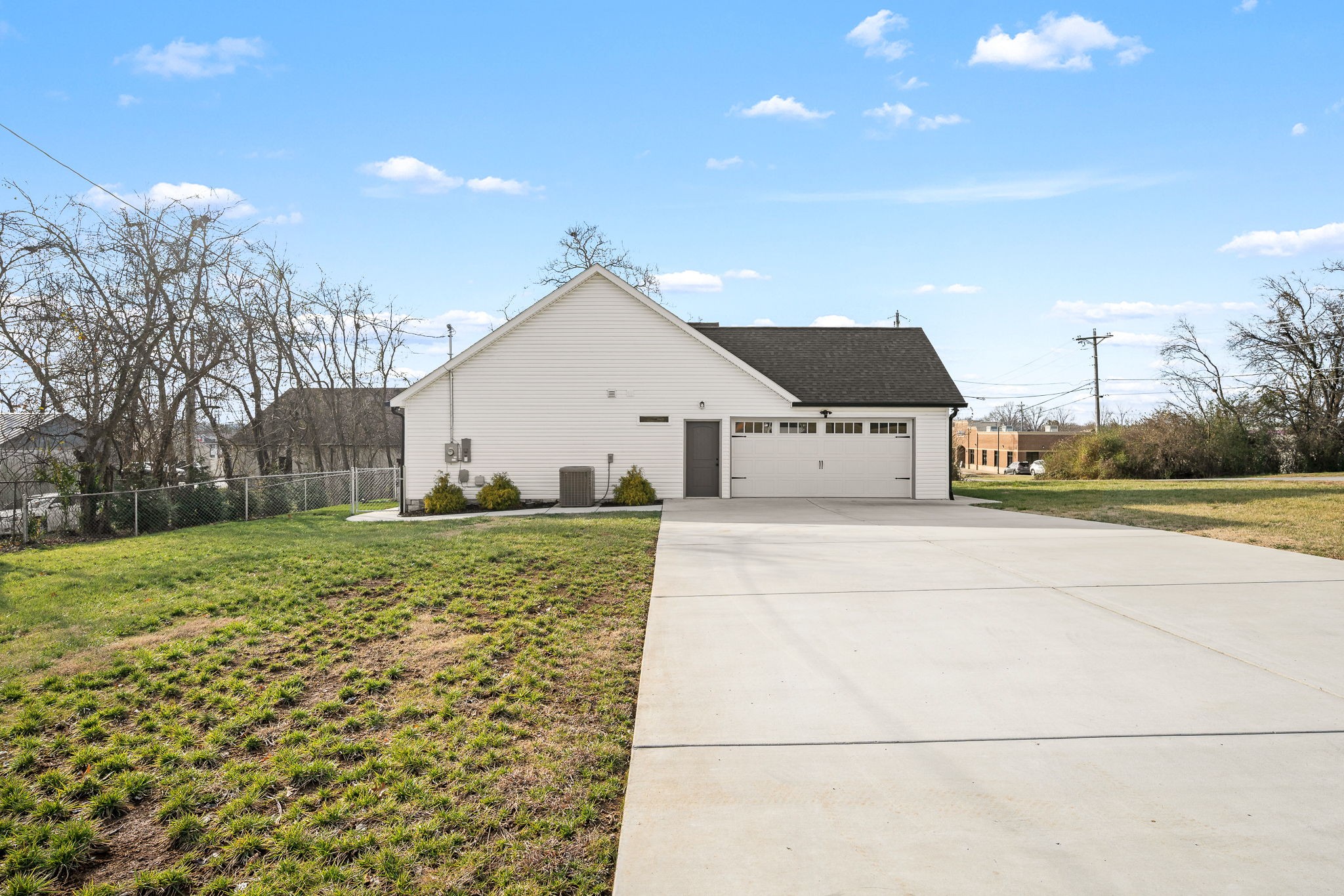 104 Rolling Road Shelbyville, TN 37160 - Photo 43 of 44 a front view of a house with a yard and garage