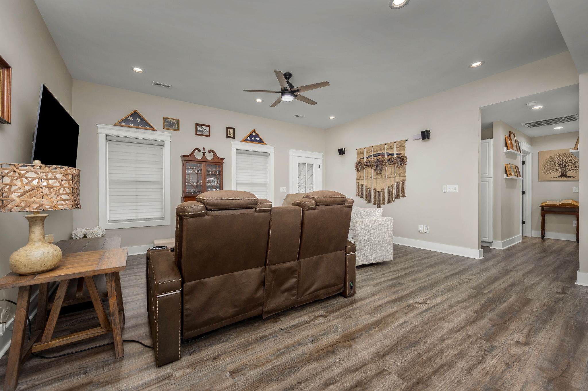 104 Rolling Road Shelbyville, TN 37160 - Photo 9 of 44 a living room with furniture a flat screen tv and kitchen view