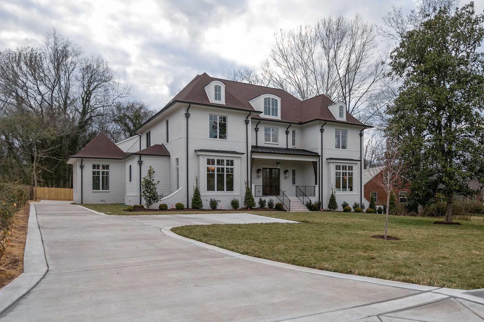 a front view of a house with a yard