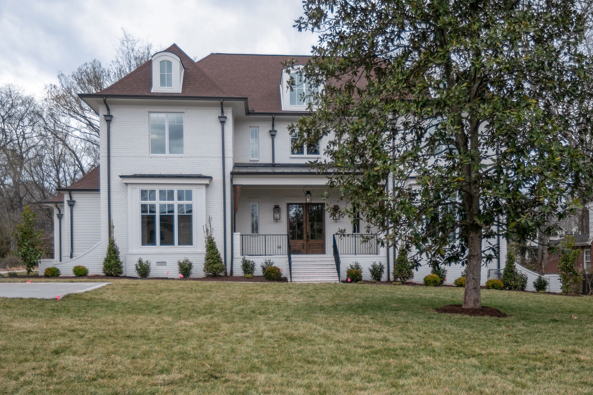 4101 Sneed Road Nashville, TN 37215 - Photo 2 of 63 a front view of a house with a garden
