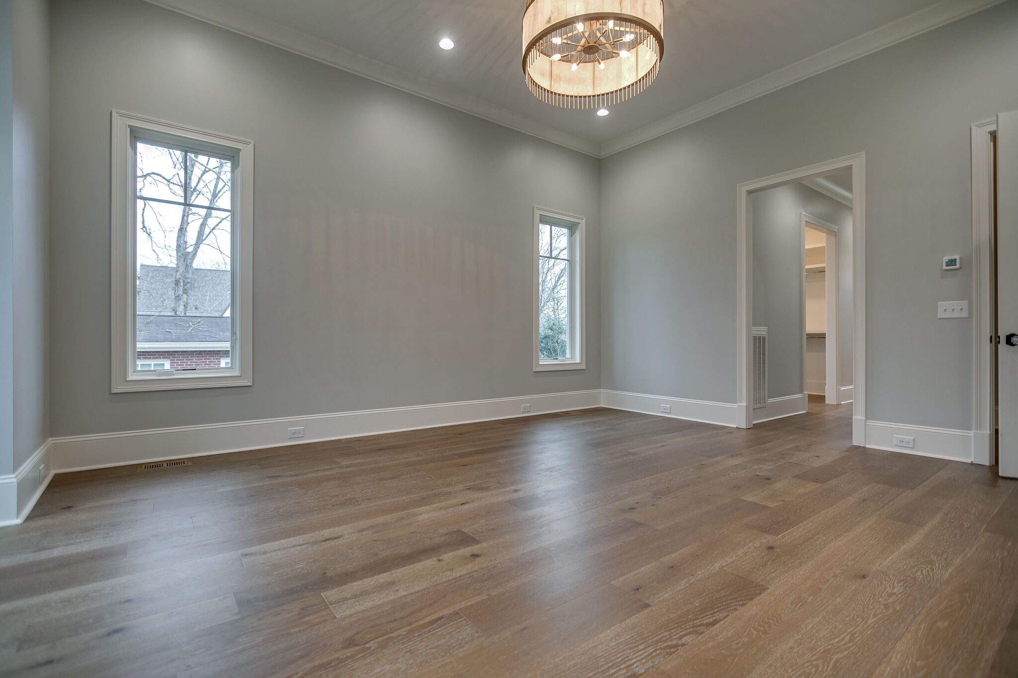 4101 Sneed Road Nashville, TN 37215 - Photo 29 of 63 an empty room with wooden floor and windows