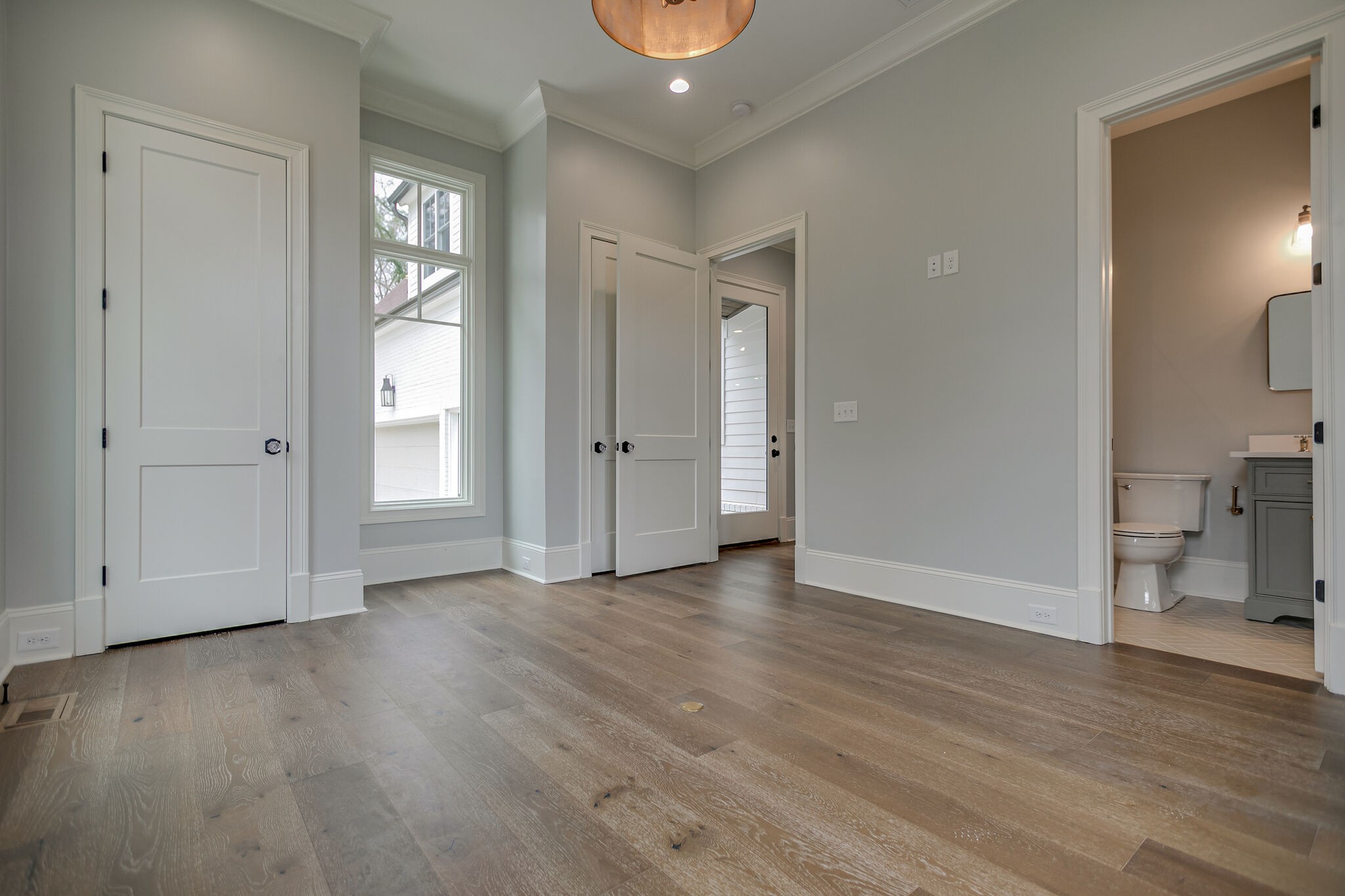 4101 Sneed Road Nashville, TN 37215 - Photo 36 of 63 an empty room with wooden floor and a window