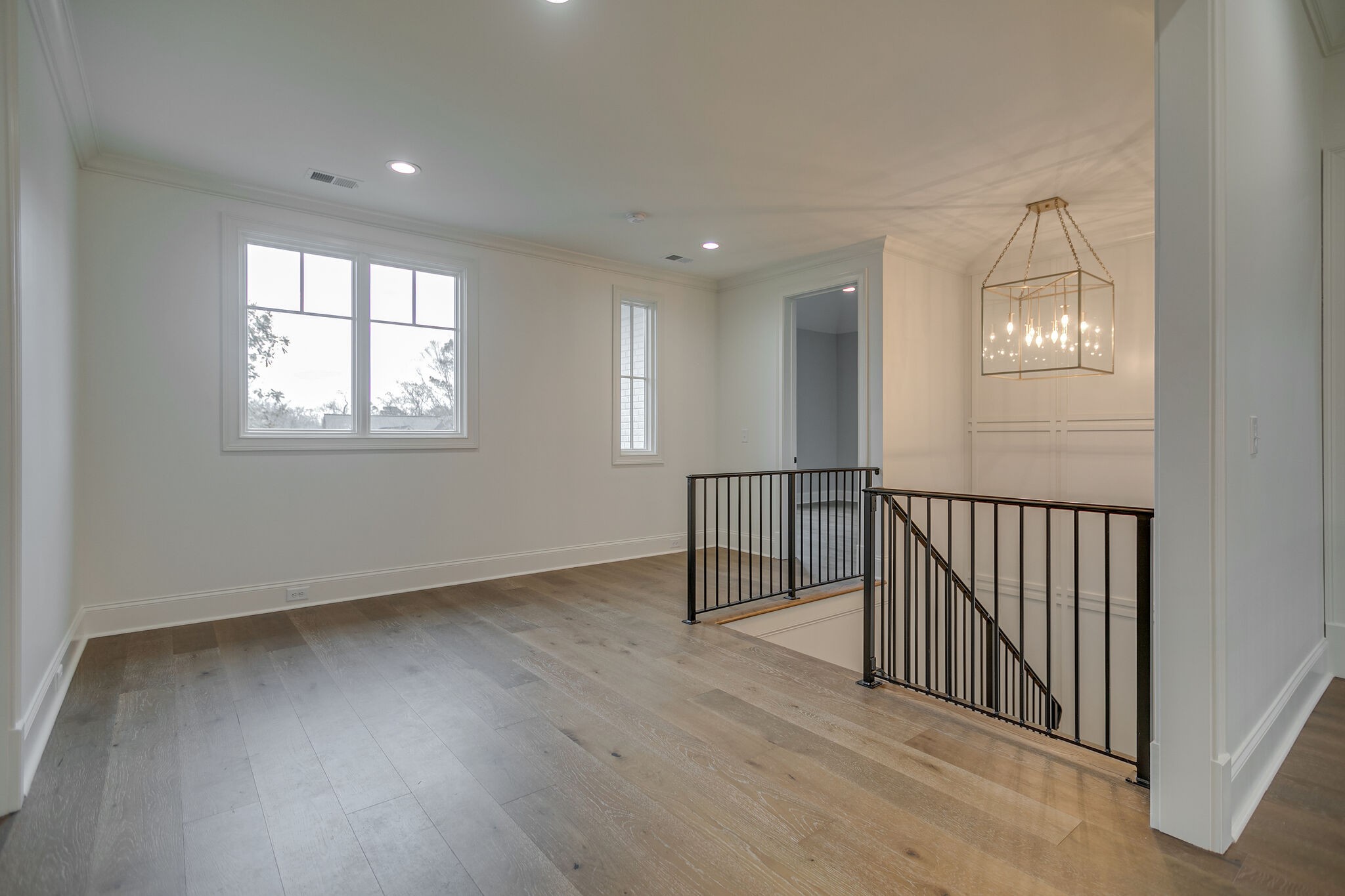 4101 Sneed Road Nashville, TN 37215 - Photo 38 of 63 an empty room with wooden floor and windows