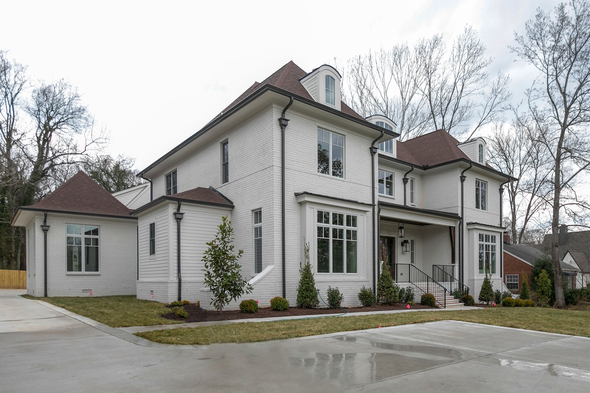 4101 Sneed Road Nashville, TN 37215 - Photo 4 of 63 a view of a white house with a large windows