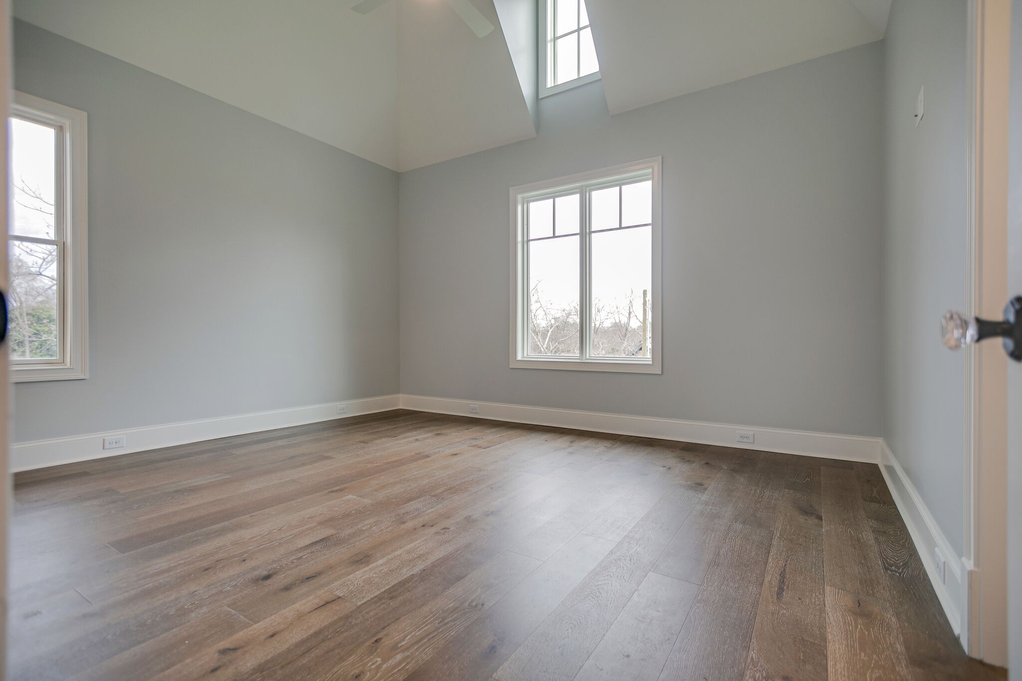 4101 Sneed Road Nashville, TN 37215 - Photo 46 of 63 an empty room with wooden floor and windows