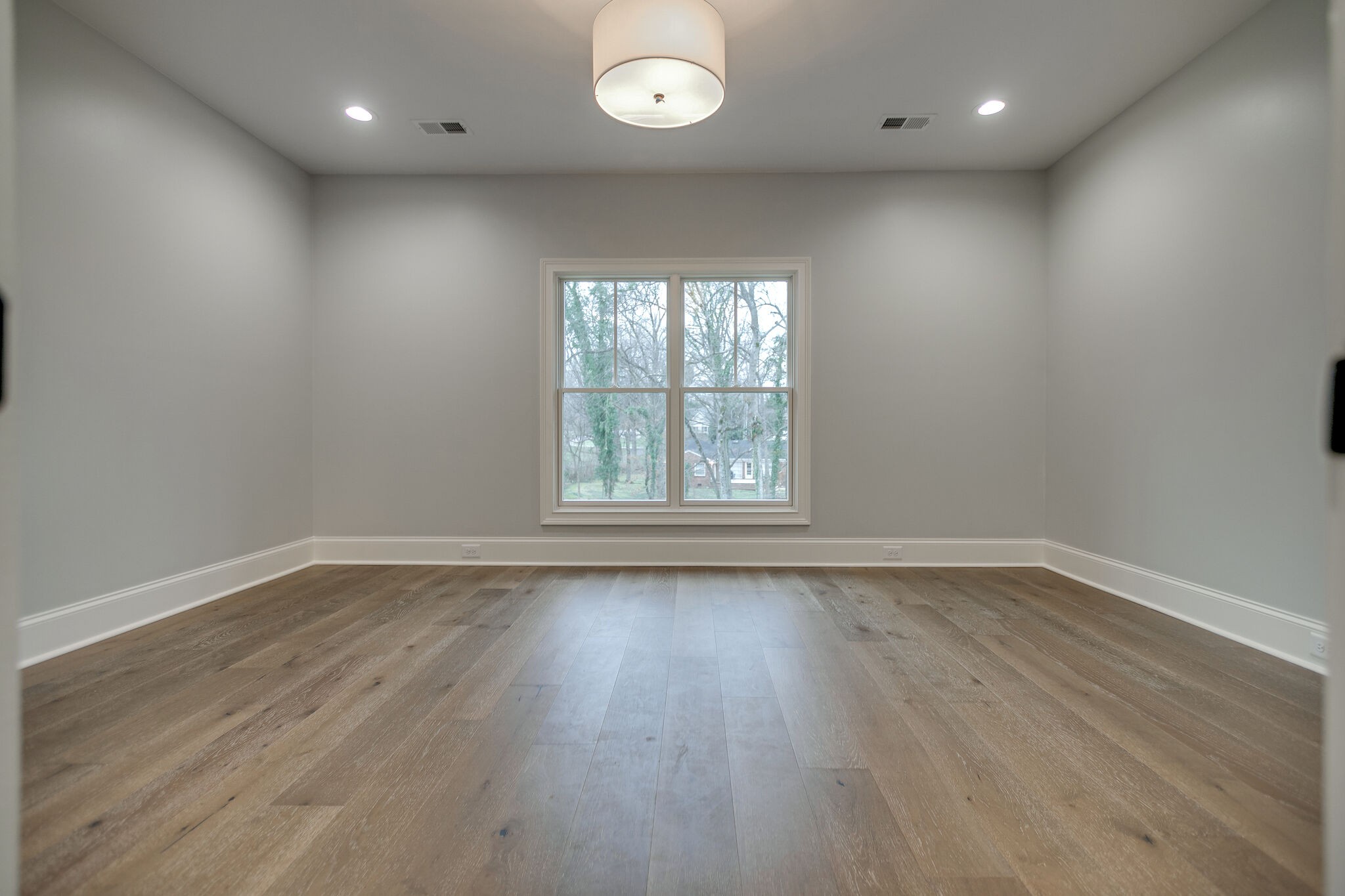 4101 Sneed Road Nashville, TN 37215 - Photo 50 of 63 an empty room with wooden floor and windows