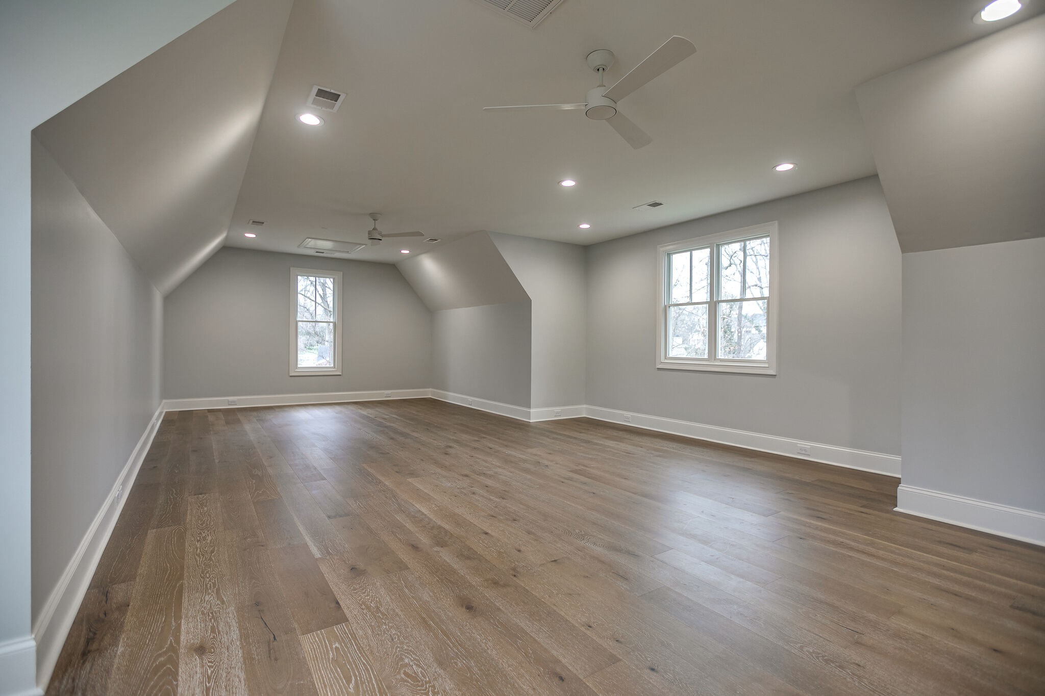 4101 Sneed Road Nashville, TN 37215 - Photo 53 of 63 an empty room with wooden floor and windows