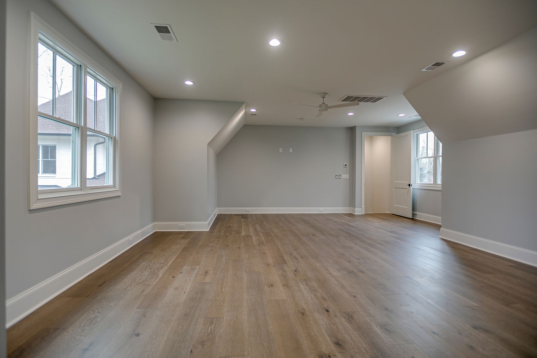 4101 Sneed Road Nashville, TN 37215 - Photo 54 of 63 an empty room with wooden floor and windows