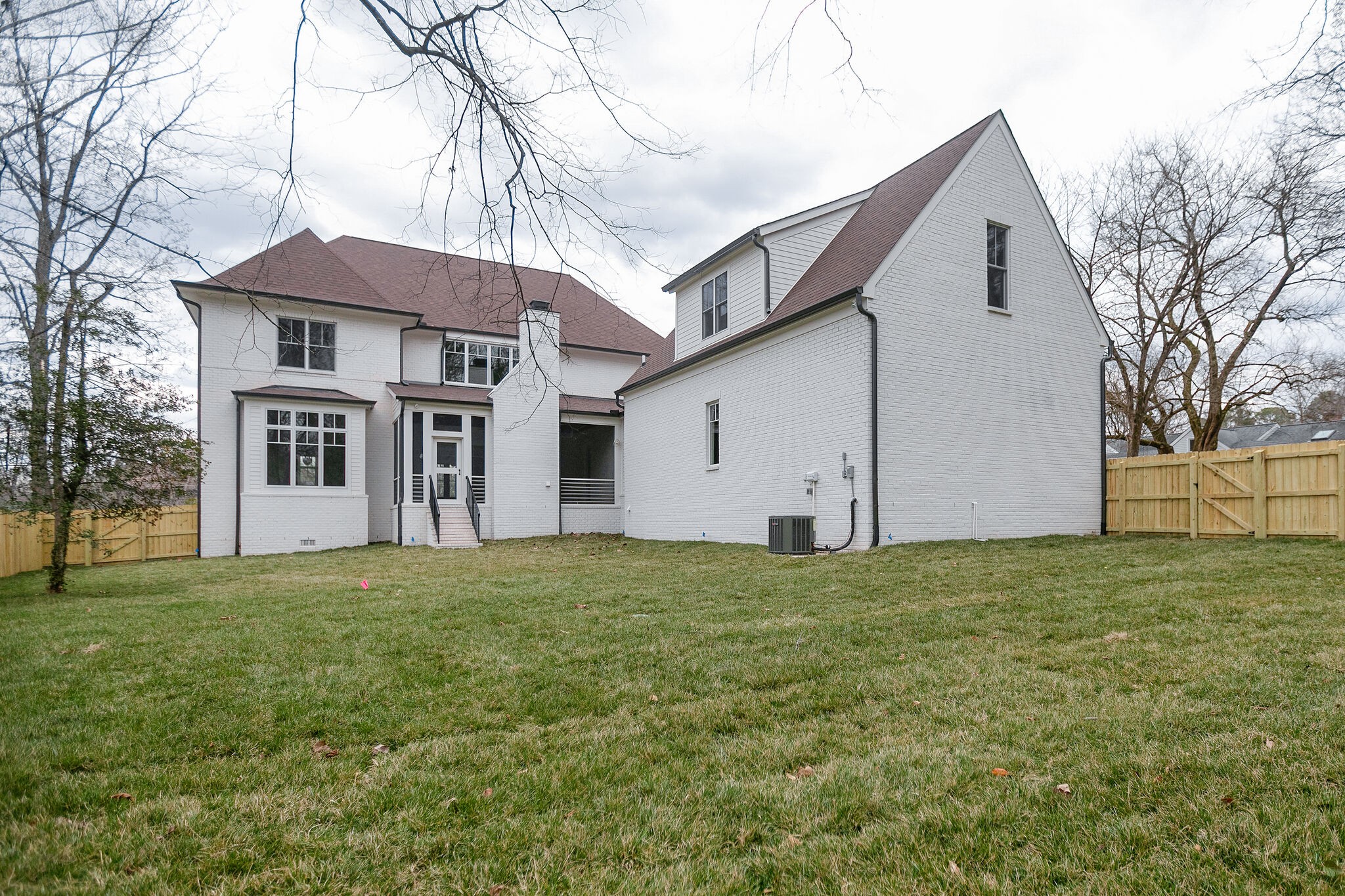 4101 Sneed Road Nashville, TN 37215 - Photo 59 of 63 a house that is sitting in the grass with large trees