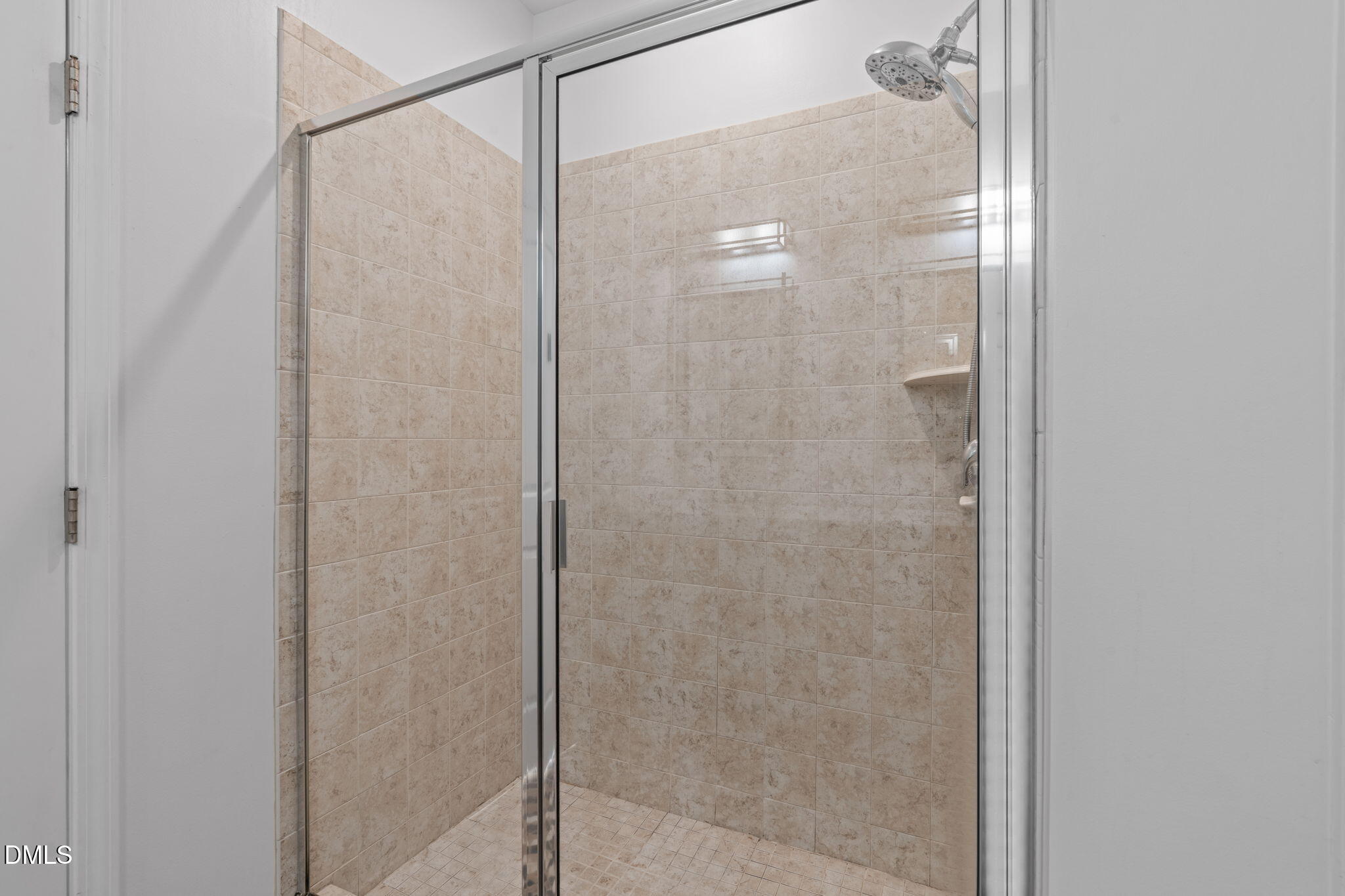 124 Daneborg Road Durham, NC 27703 - Photo 14 of 40 a bathroom with a glass shower door