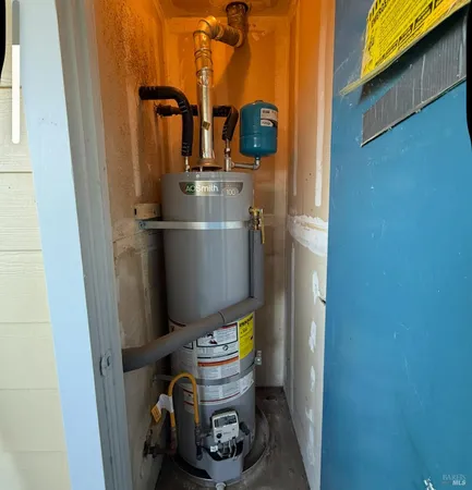 a bathroom with a toilet and a wooden door