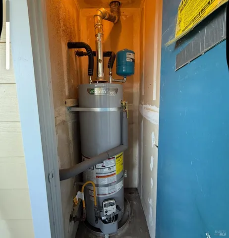 a bathroom with a toilet and a wooden door