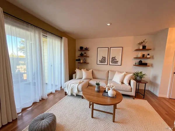 a living room with furniture and a window