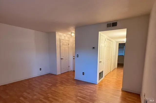 a view of a livingroom with wooden floor