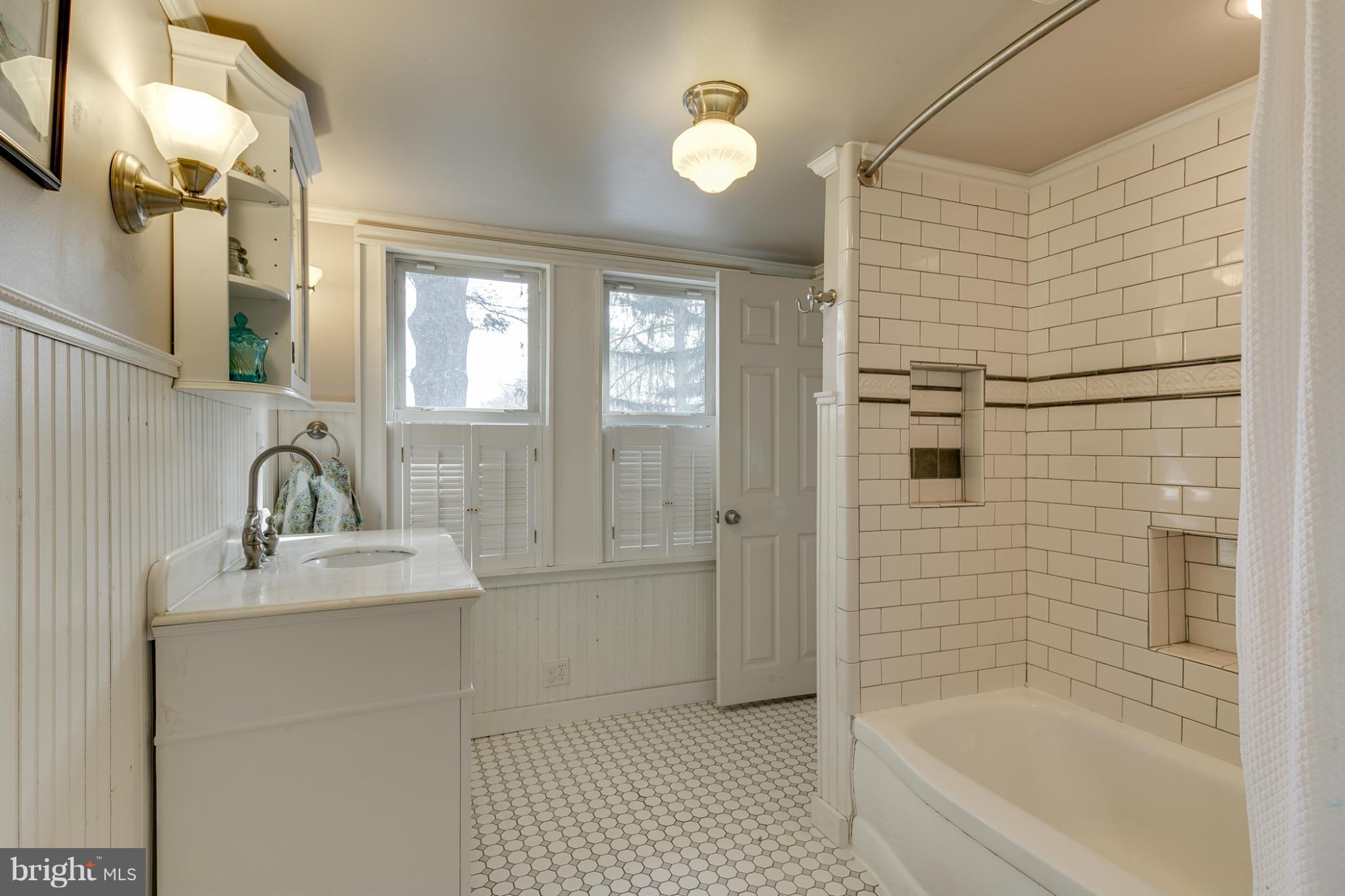 5324 Sweet Air Road Baldwin, MD 21013 - Photo 17 of 30 a bathroom with a bathtub shower sink vanity and a mirror