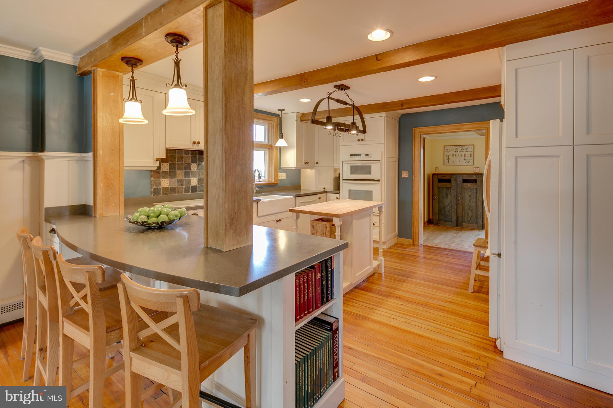 5324 Sweet Air Road Baldwin, MD 21013 - Photo 10 of 30 a kitchen with stainless steel appliances a dining table chairs and wooden floor