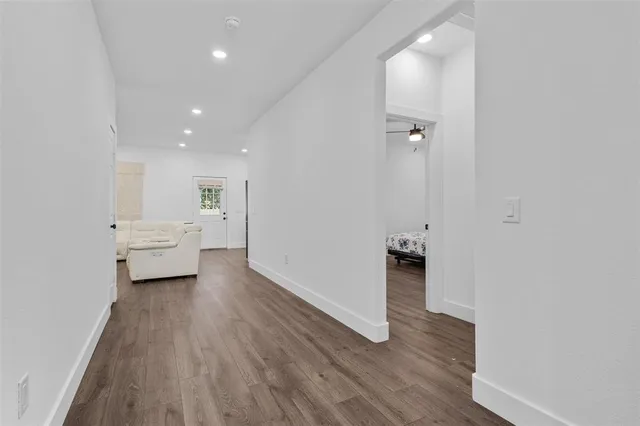 a view of a livingroom with furniture and wooden floor