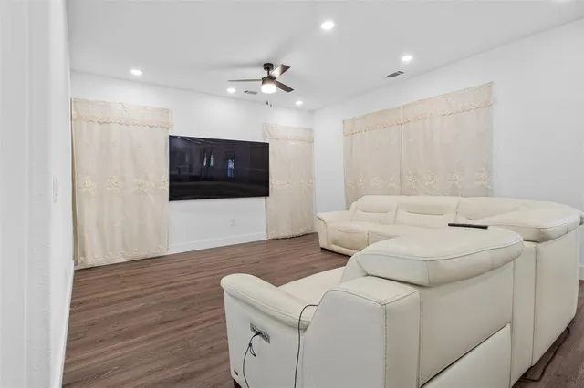 a living room with a couch and a flat screen tv