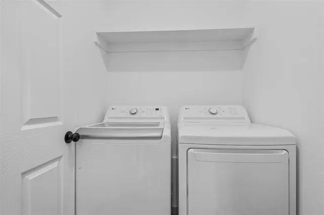 a utility room with dryer and washer
