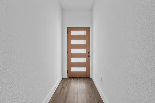 a view of a small space with wooden floor